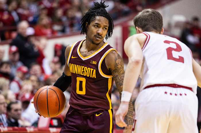 Elijah Hawkins dribbles